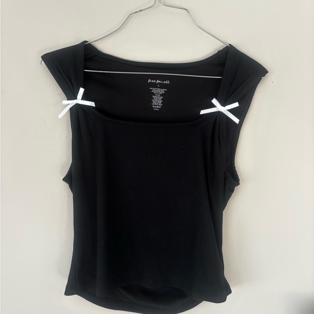 Black Sleeveless Top with White Bow Accents